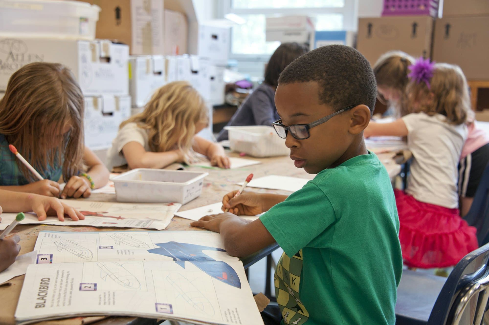 Children learning together around a table