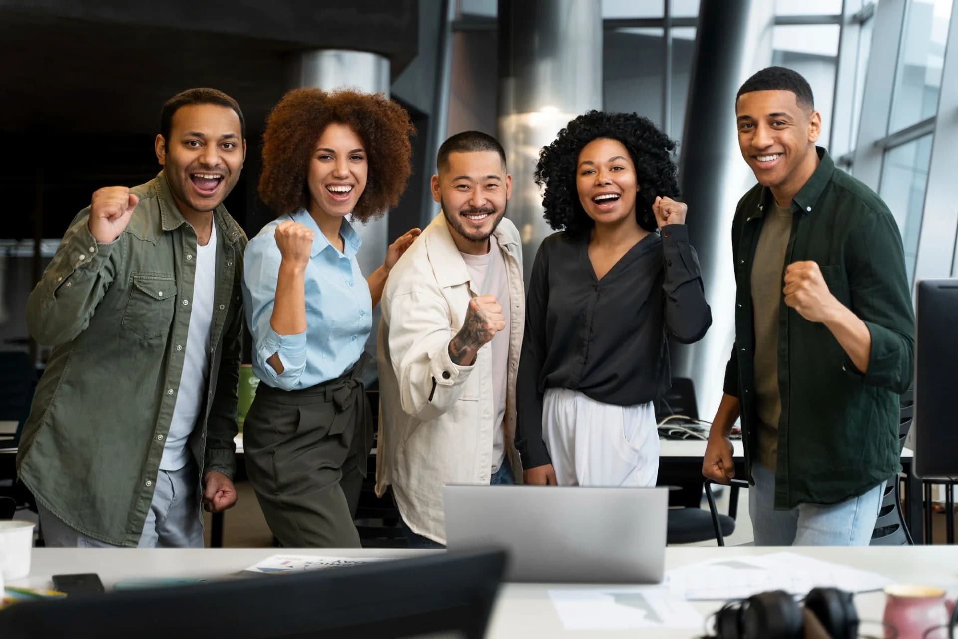 A diverse team celebrating success together